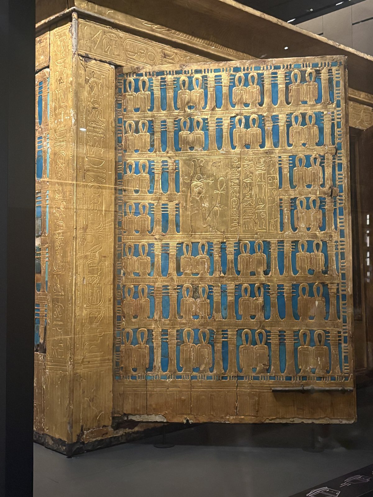 A blue and gold inscribed shrine panel