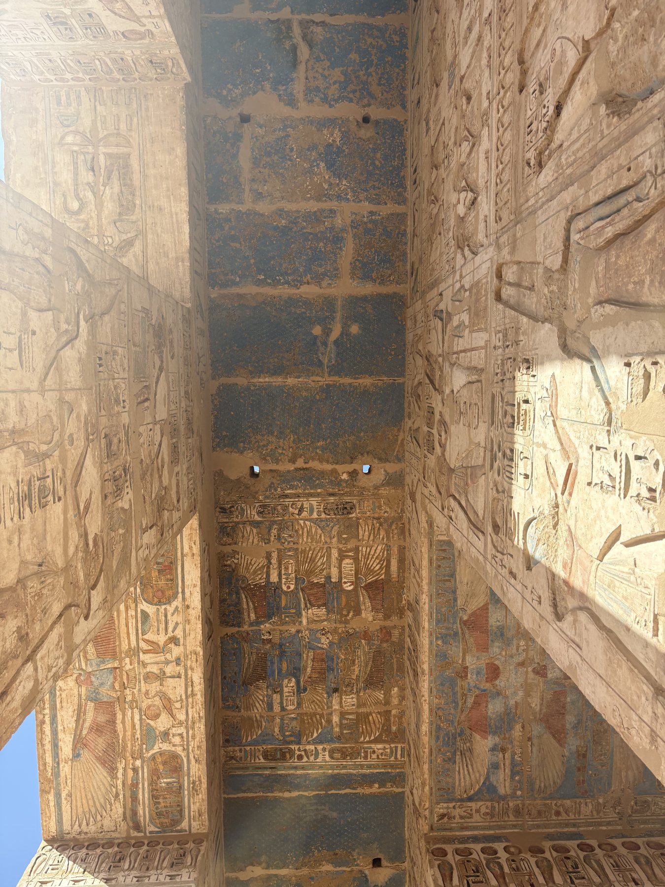 A painted temple column with hieroglyphs