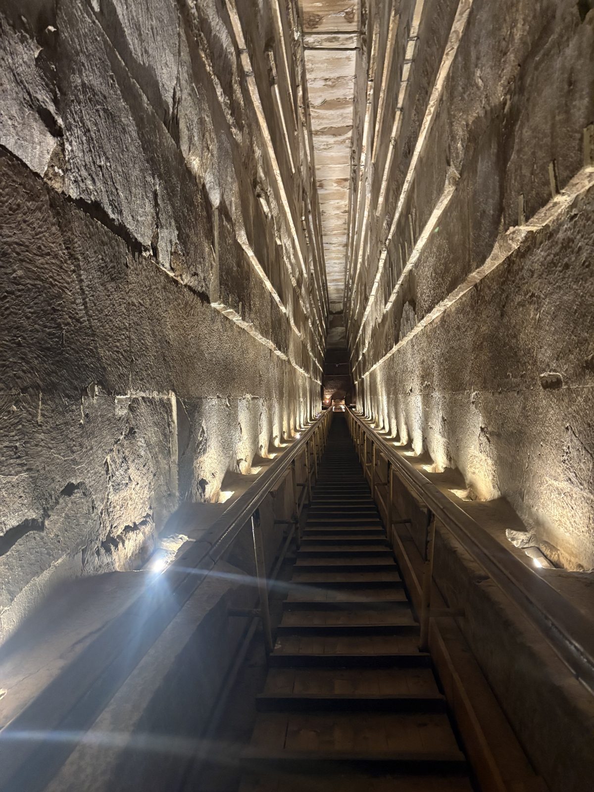 The long lit ascending passage inside the Great Pyramid of Giza