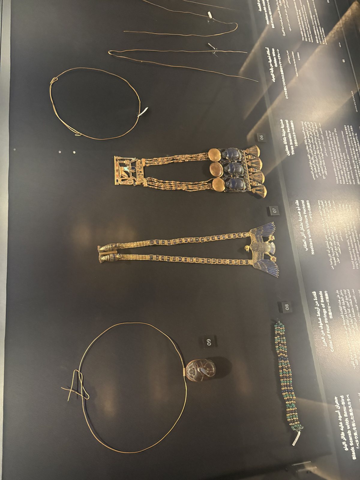 Gold pectorals and bracelets in a museum case