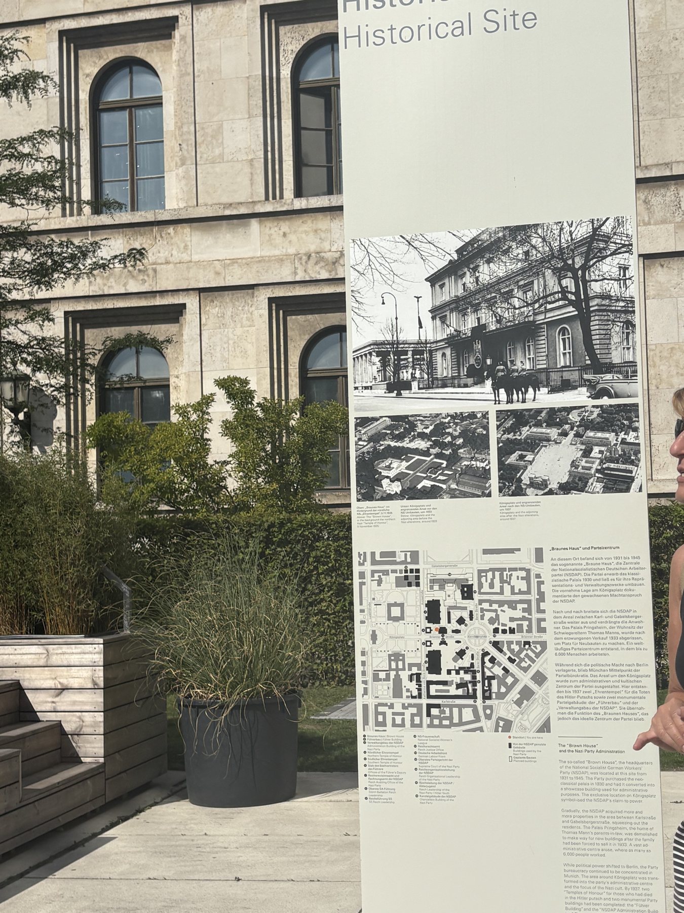 An information panel marking a historical National Socialist site in central Munich
