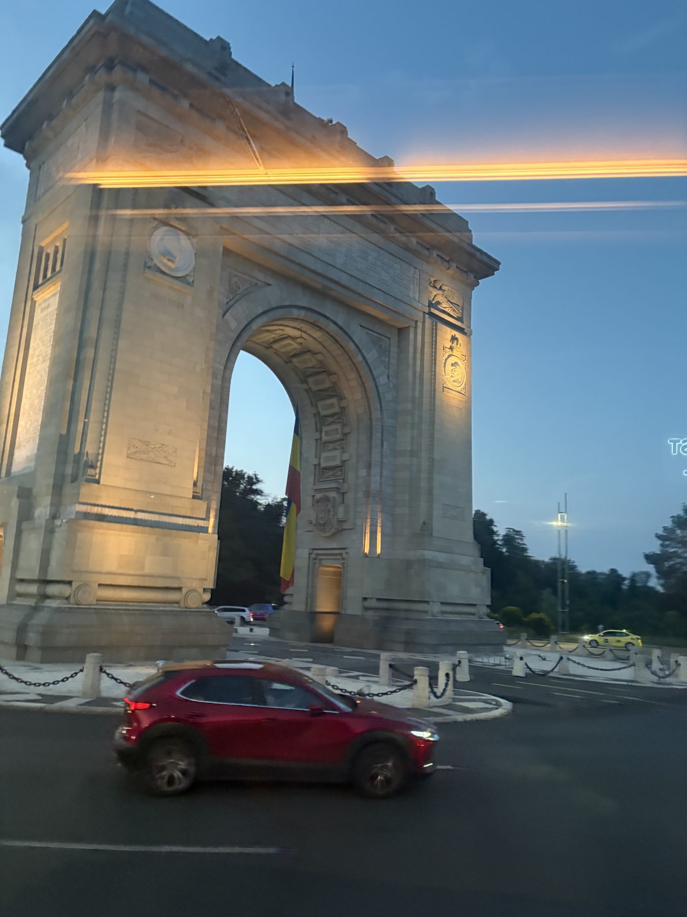 The Arch of Triumph in Bucharest at dusk