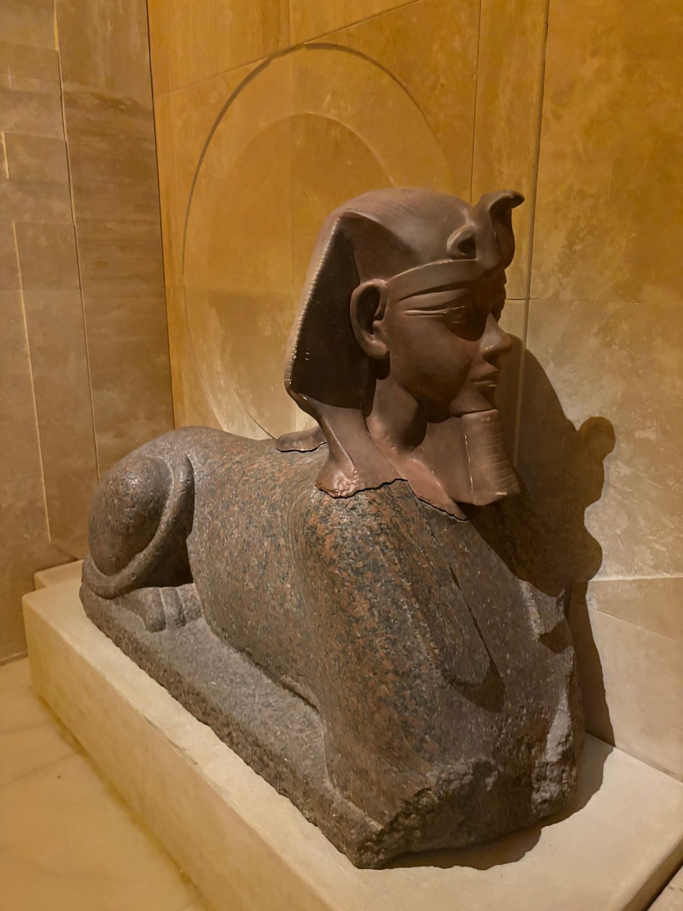 A dark stone Egyptian sphinx displayed in an Istanbul museum