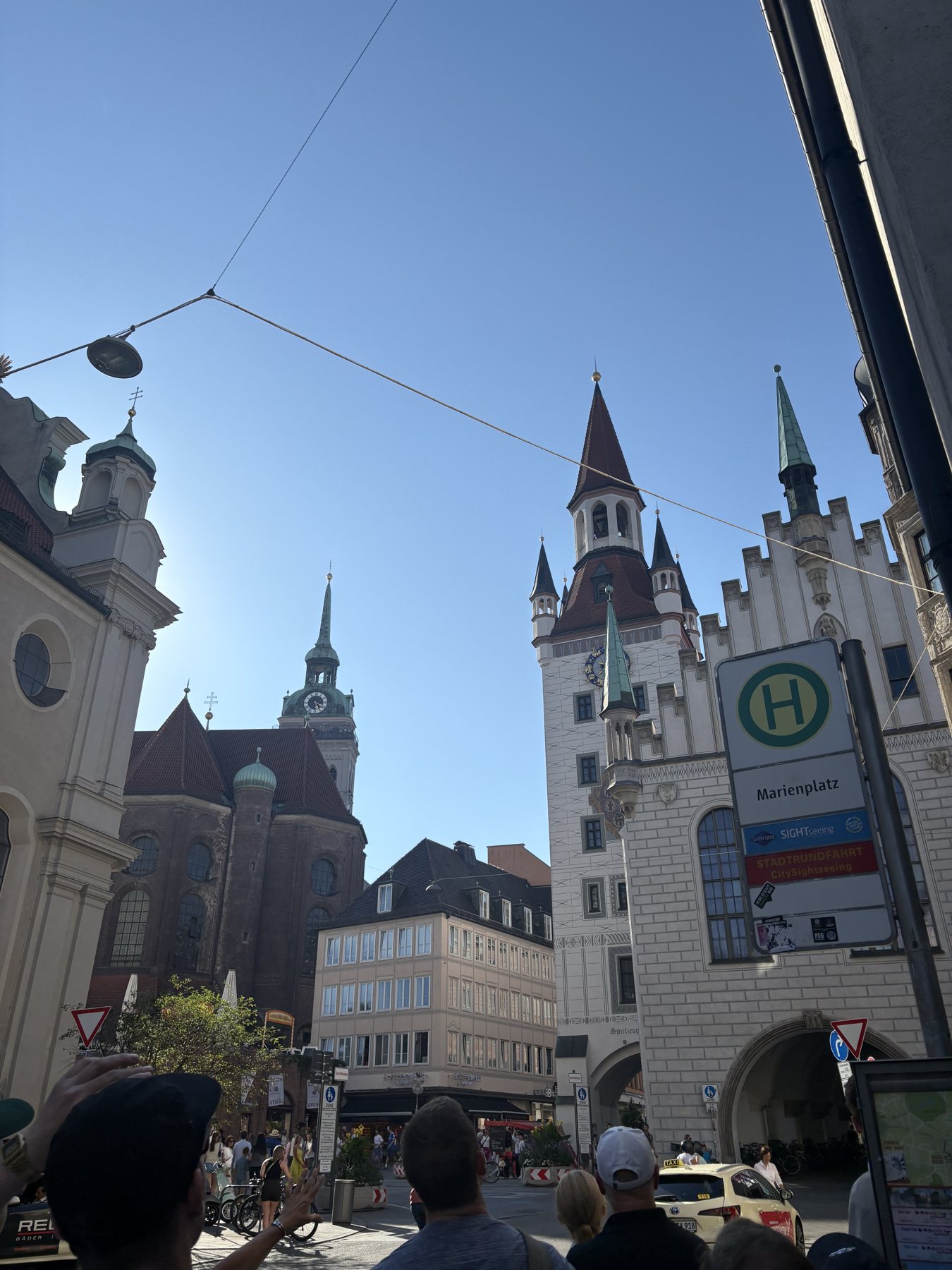 The Old Town Hall and Holy Spirit church seen from a café table at dusk