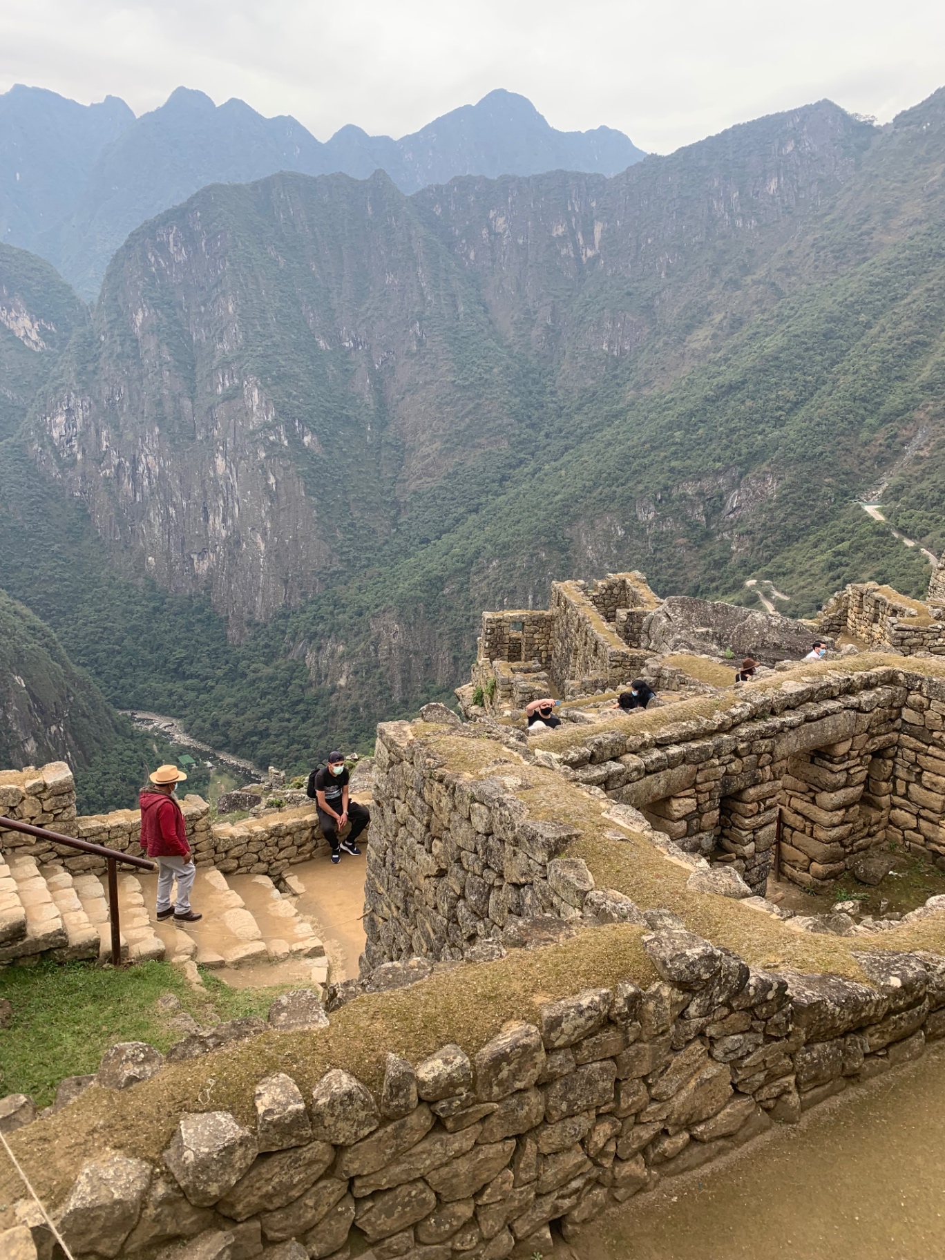 Looking out over Machu Picchu ruins into the deep green Urubamba valley