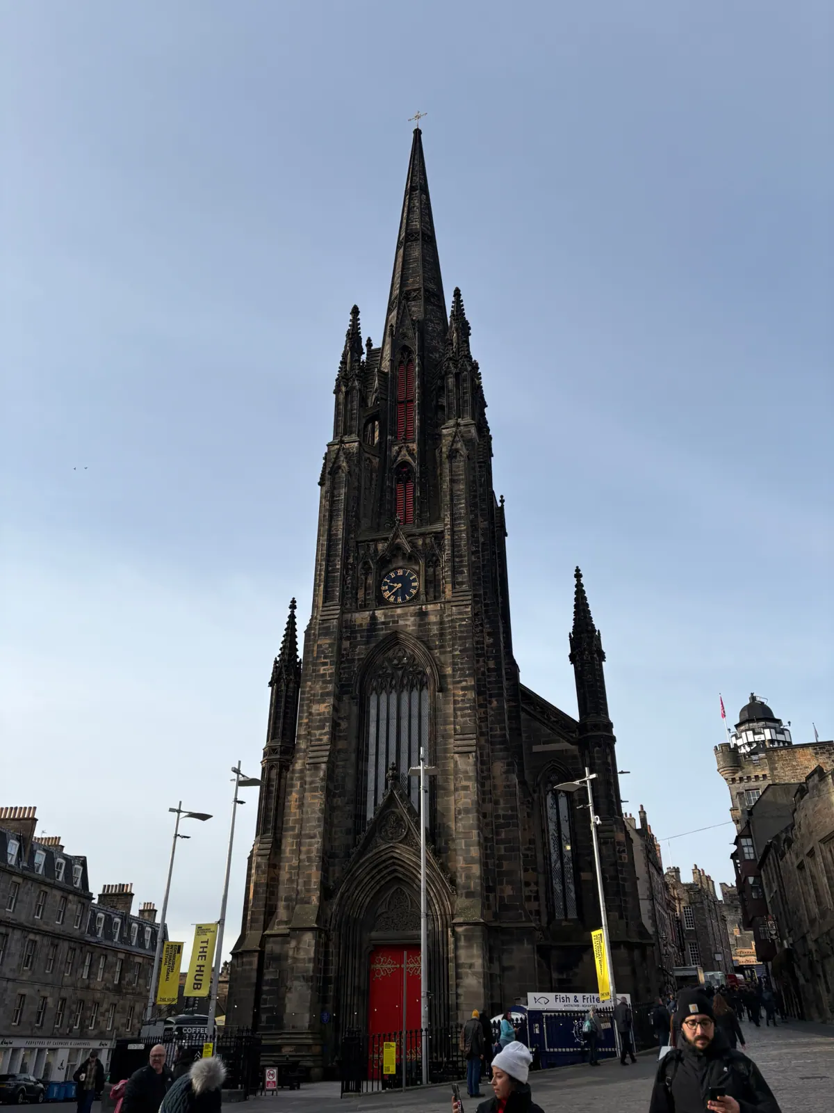 The blackened gothic spire of The Hub rising above the Royal Mile