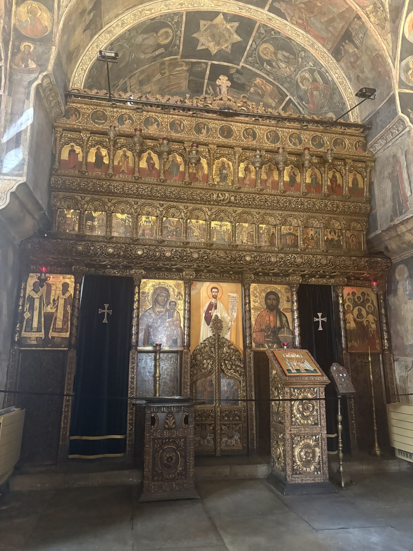 A gilded Orthodox iconostasis inside a Bucharest church