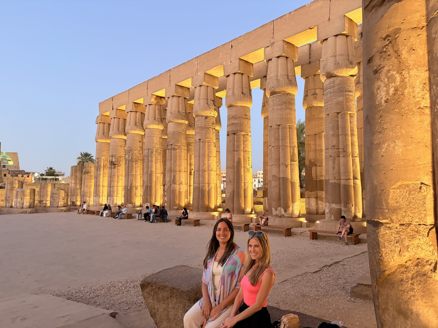 The colonnade of Luxor Temple lit at night