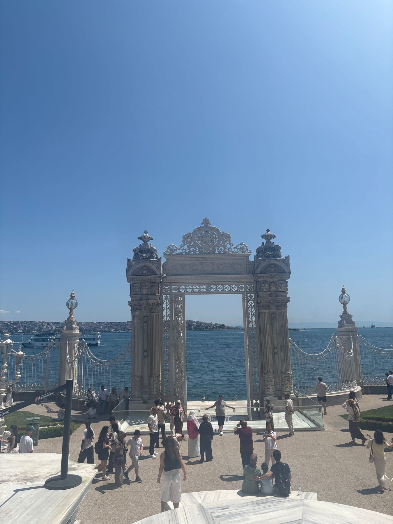 An ornate palace gate opening onto the Bosphorus