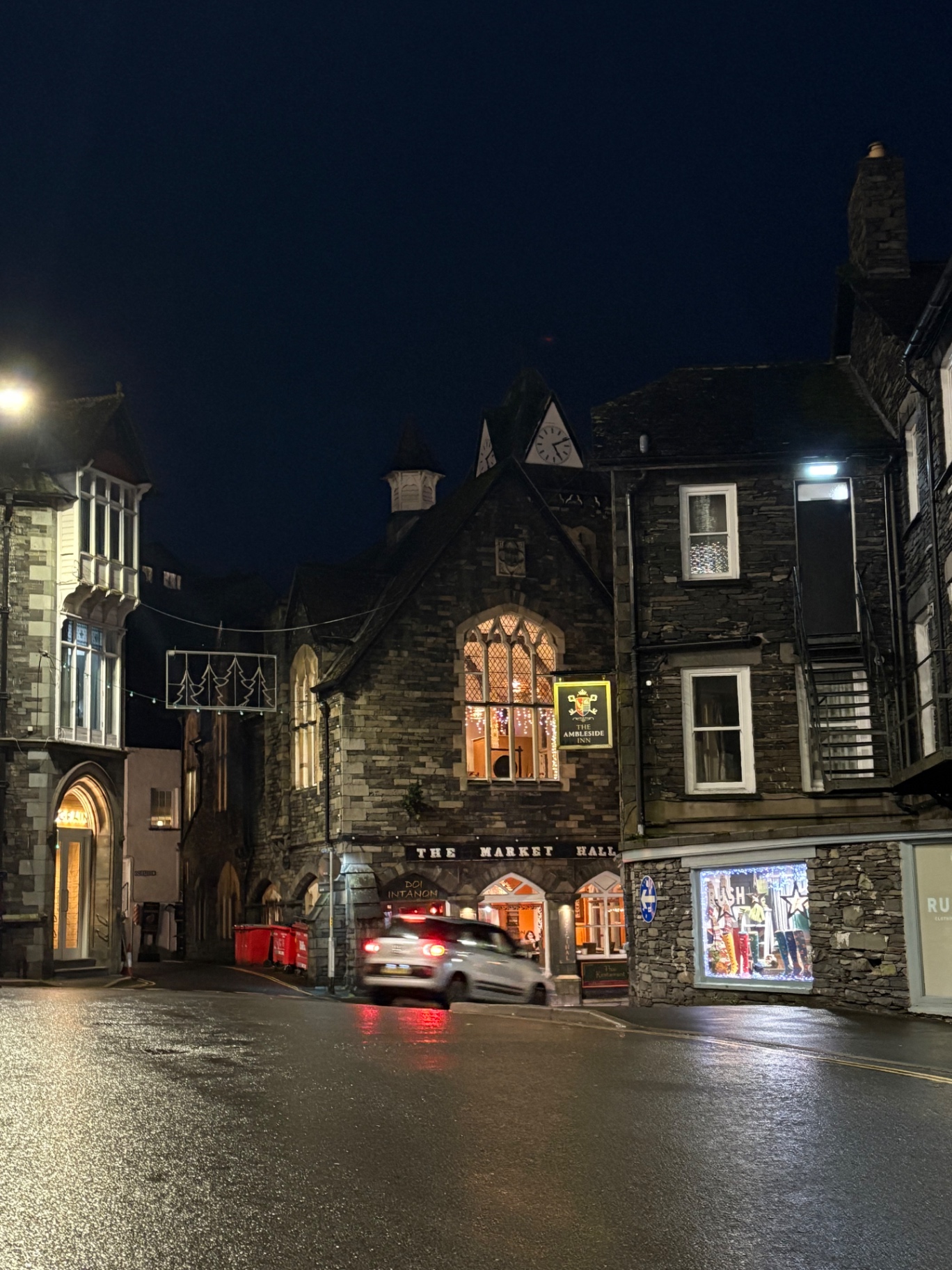 Ambleside Market Hall lit at night in the rain