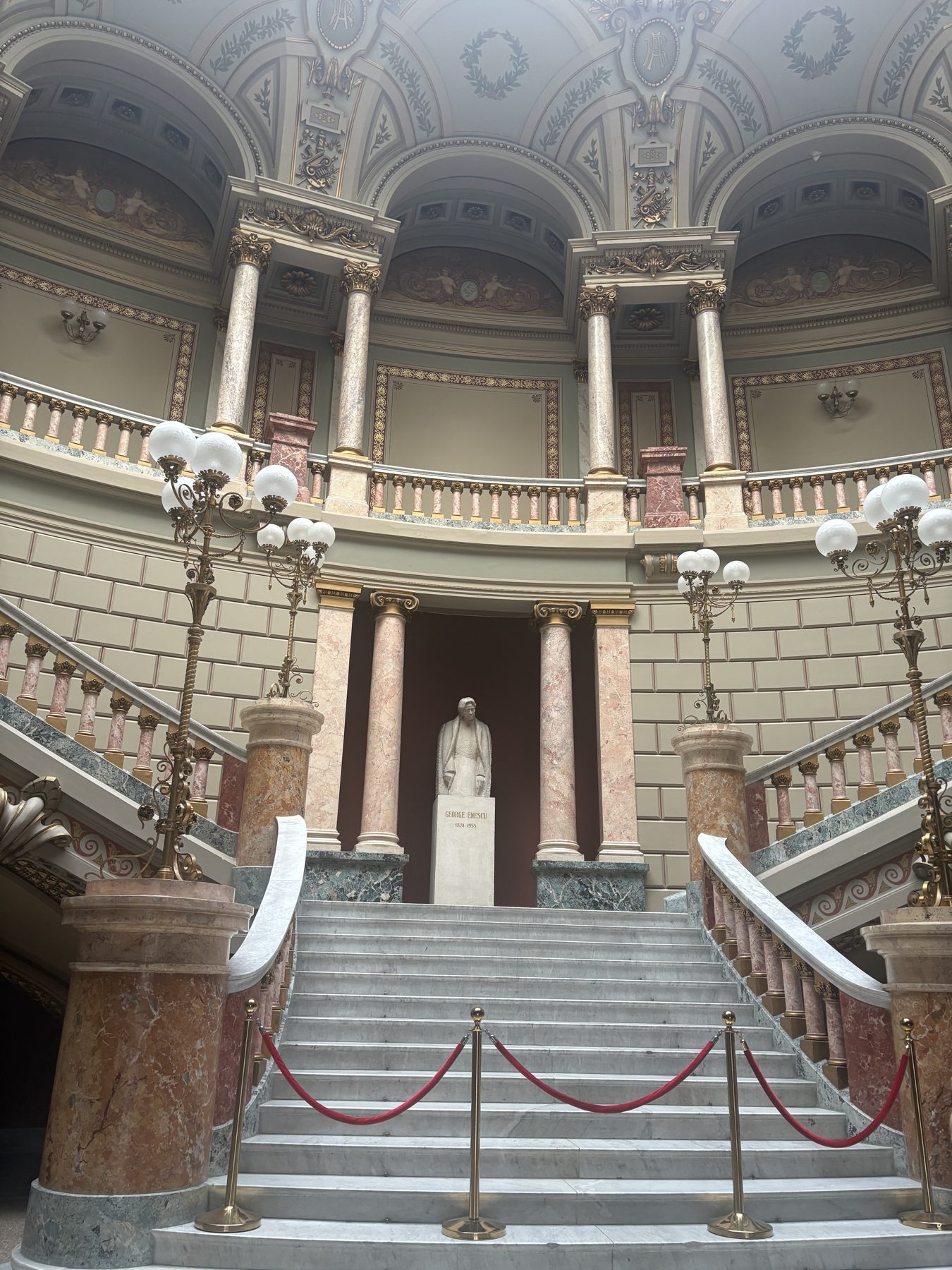 Marble columns and arches inside a Bucharest arcade