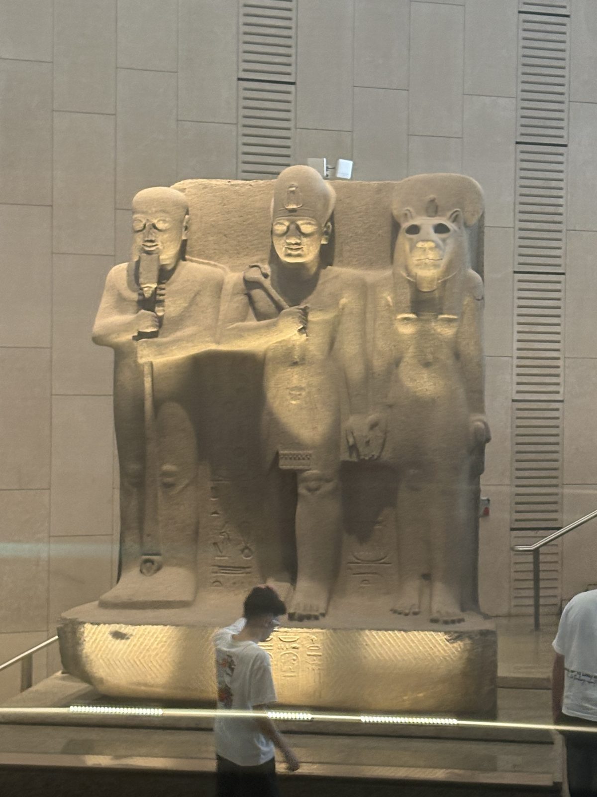 A colossal triad statue in the Grand Egyptian Museum
