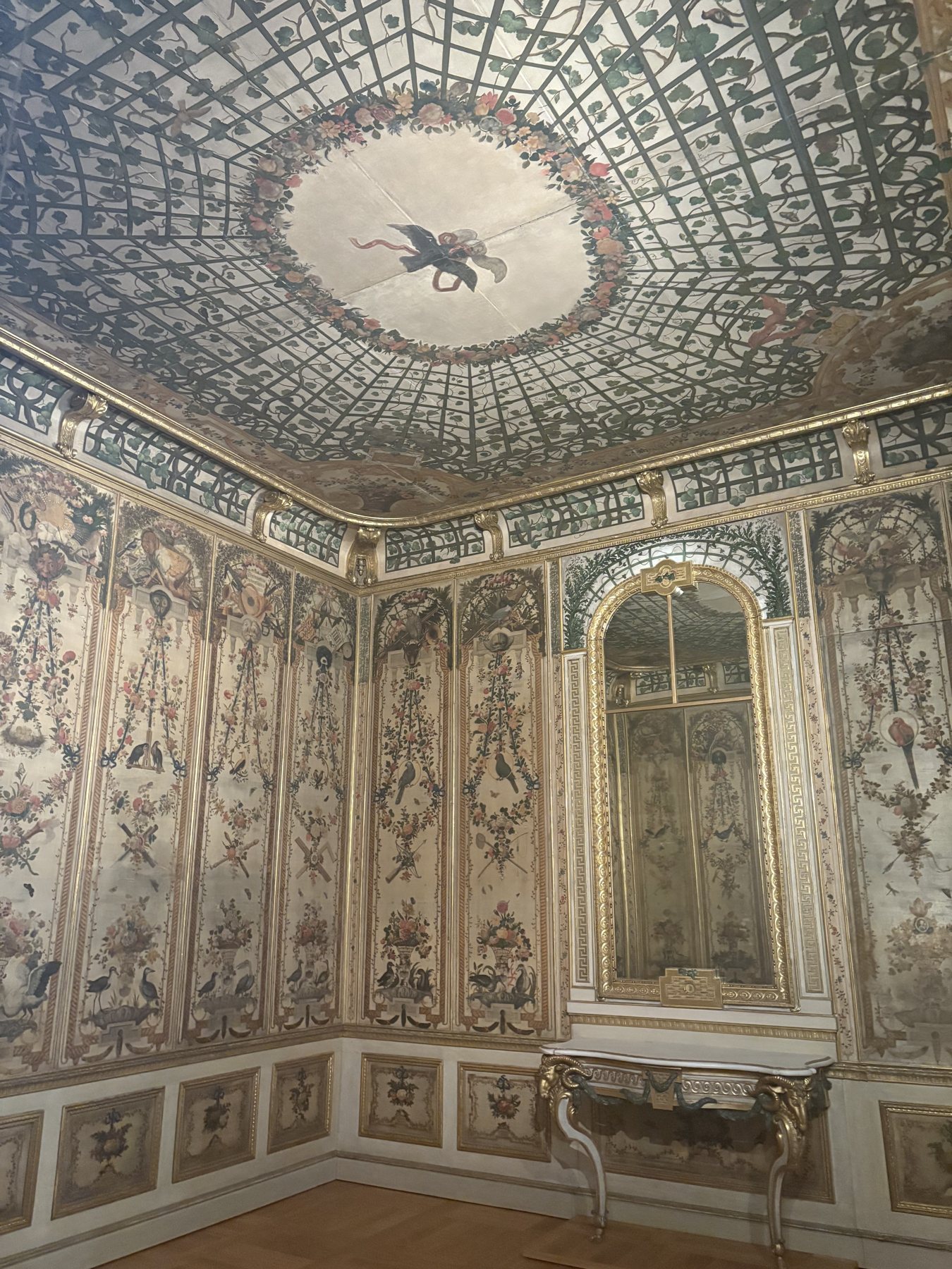 A frescoed and gilded interior room with a painted ceiling in the Bavarian National Museum