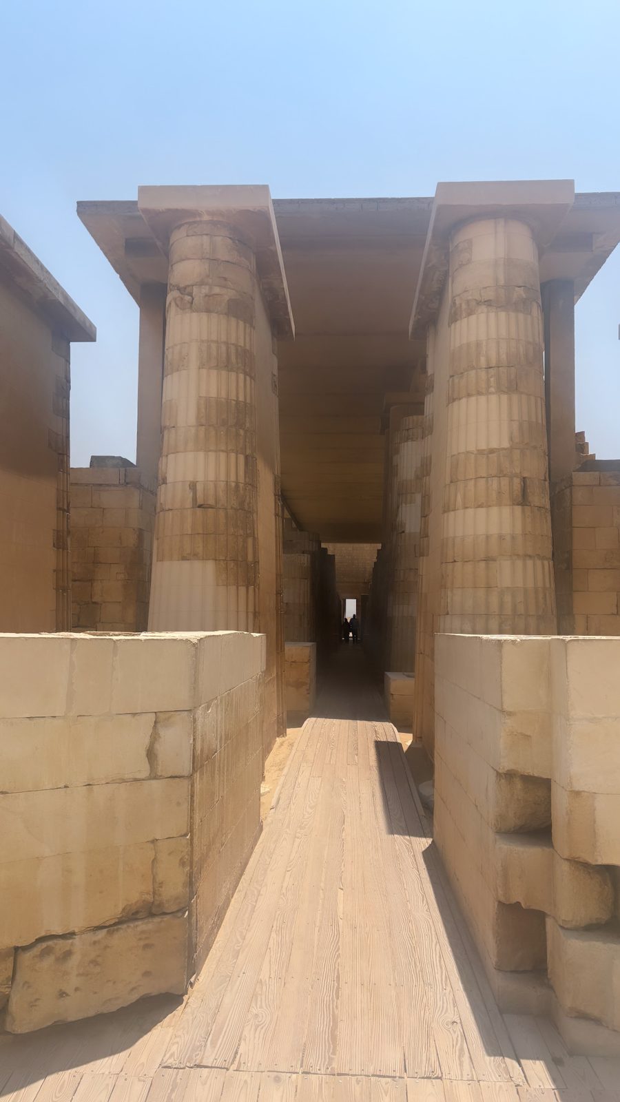 A stone causeway leading between temple walls at Saqqara