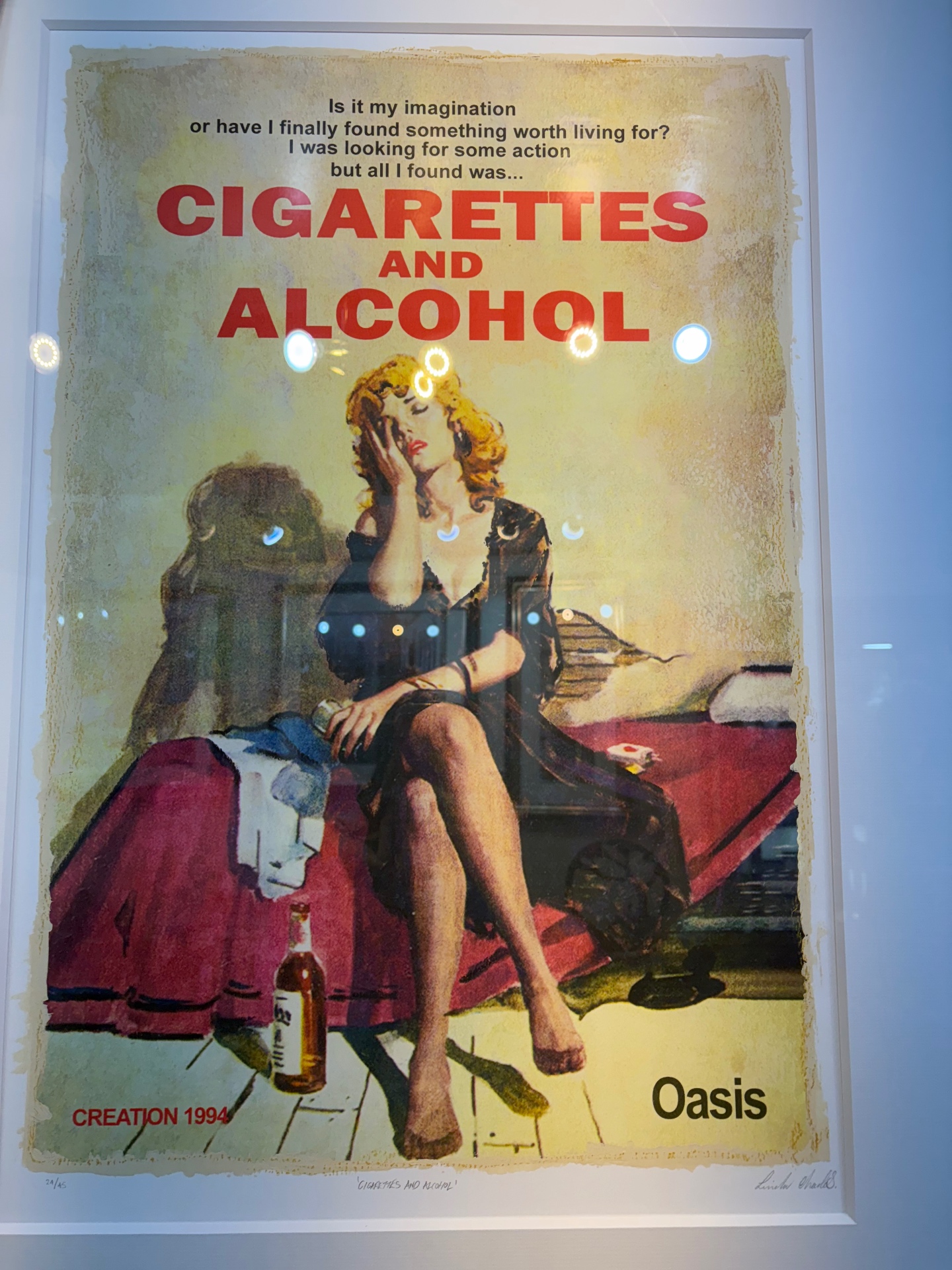 A framed Oasis Cigarettes and Alcohol print