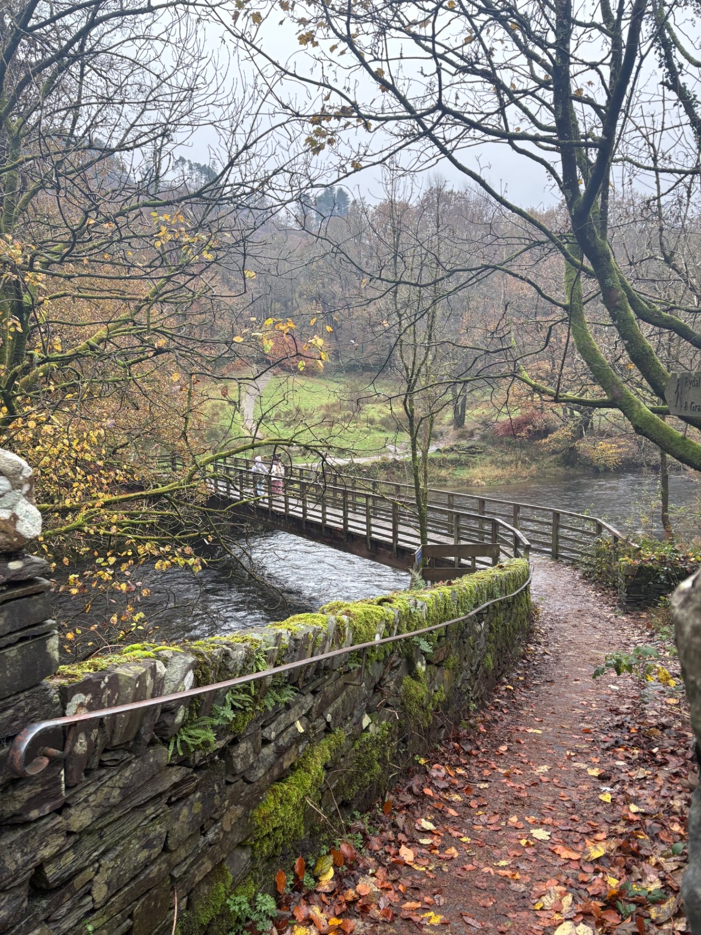 A wooden footbridge over the river on the Rydal to Grasmere path