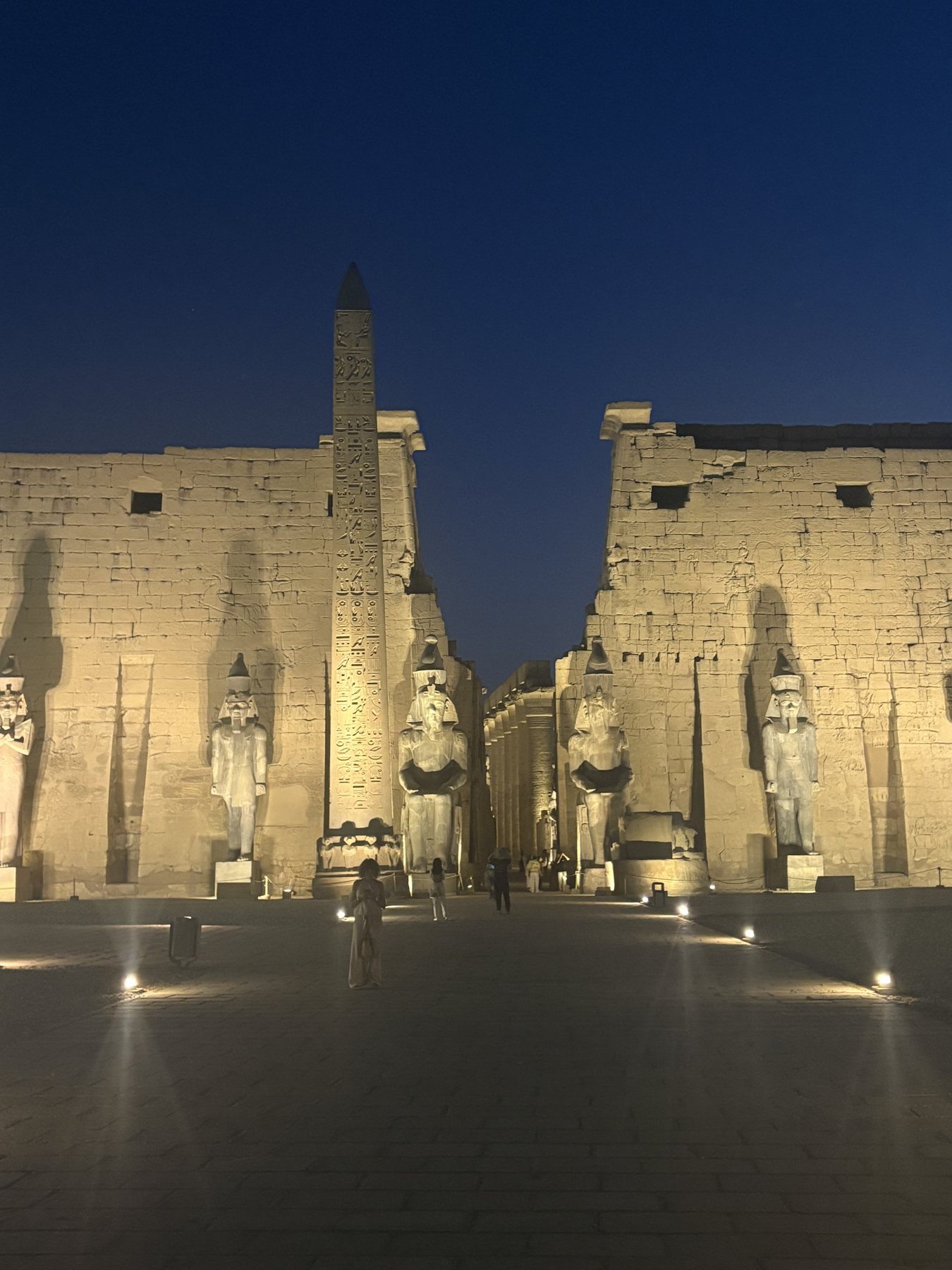 The pylon of Luxor Temple lit at night