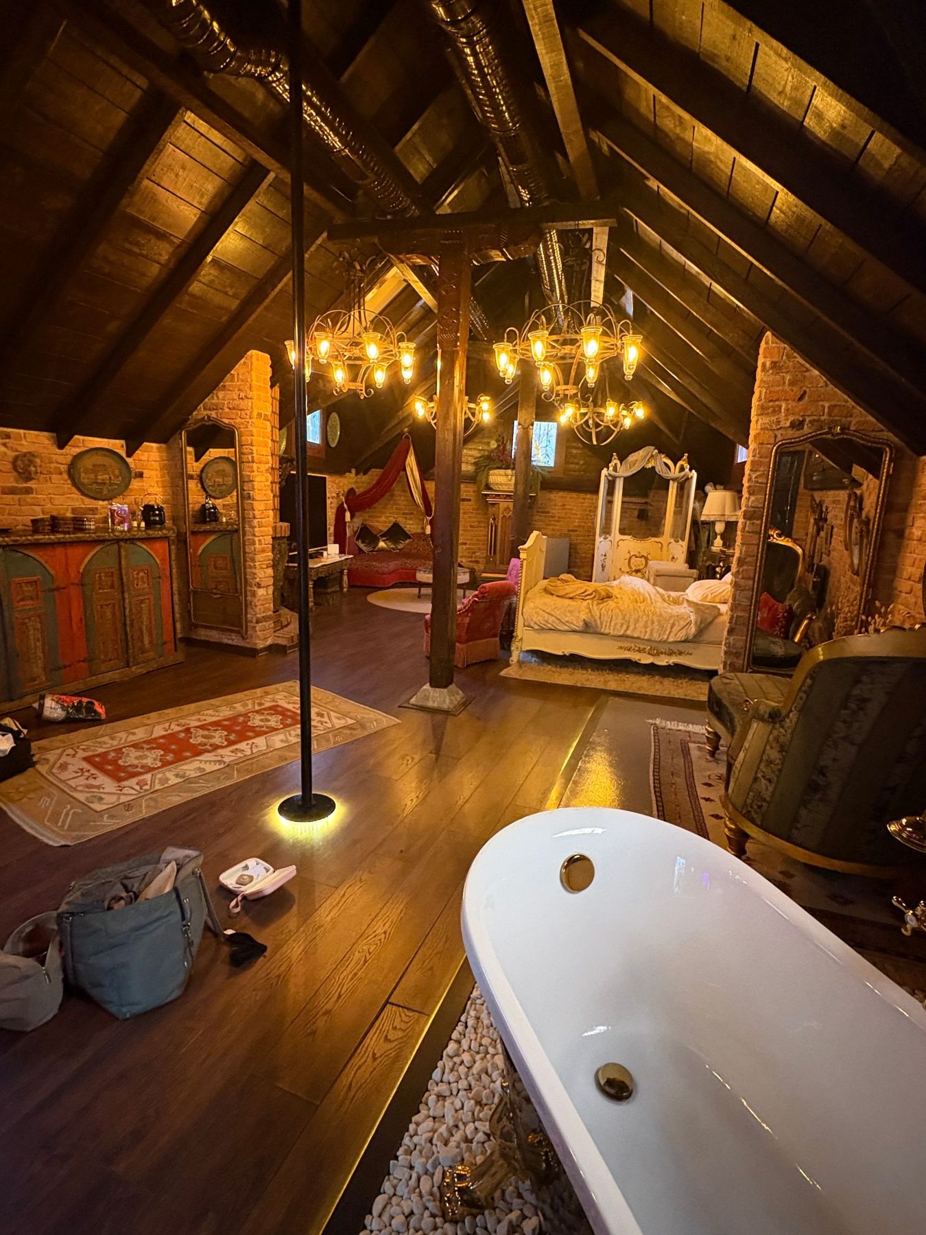 A wood-beamed hotel room with lanterns and carpets in Istanbul