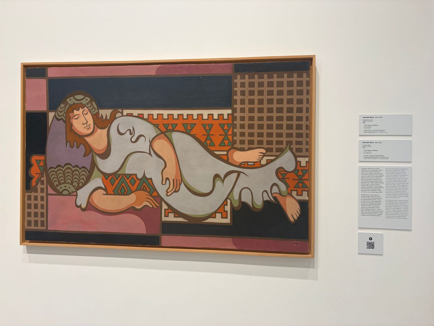 A bold modern painting of a reclining figure in pink and black