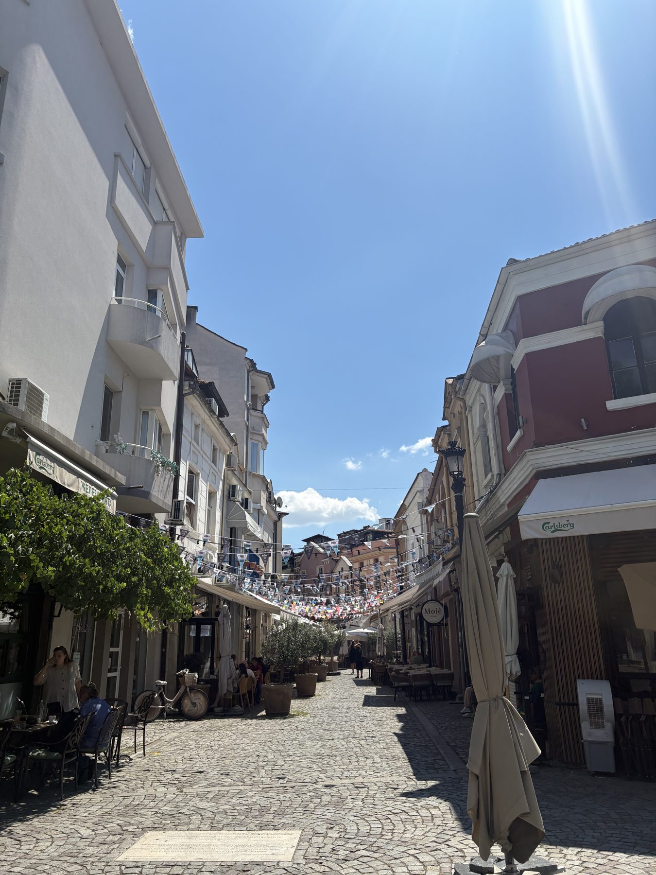 A cobbled pedestrian lane with cafes in the Kapana district