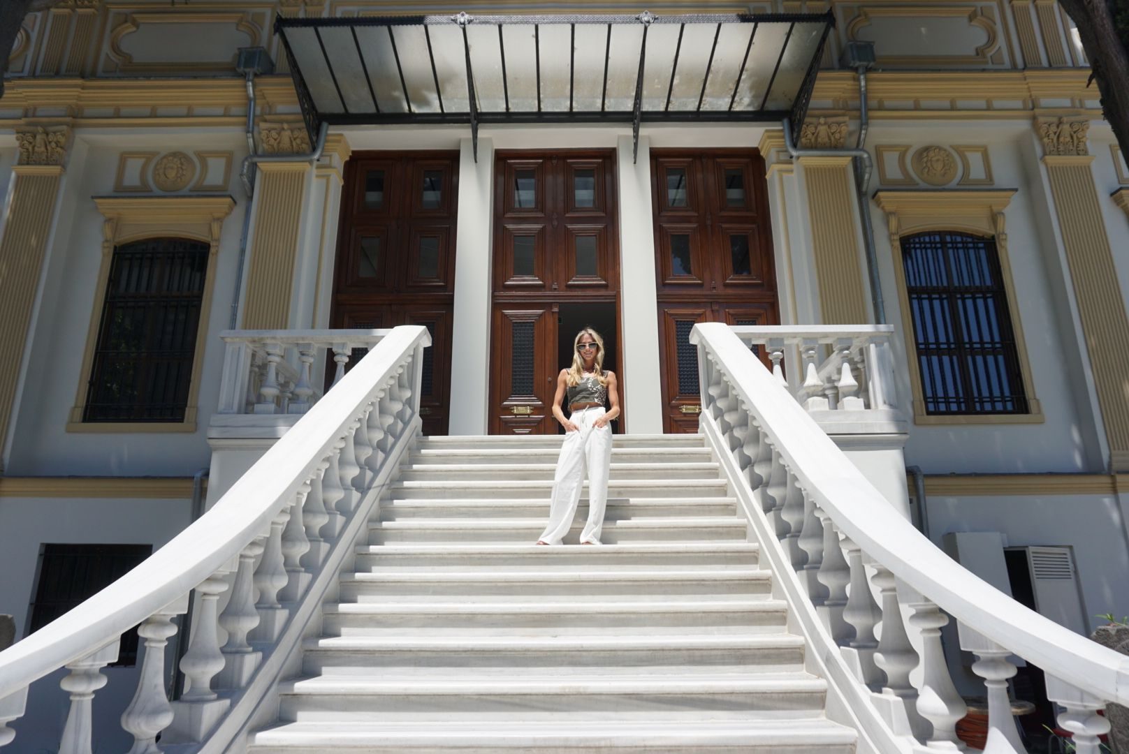 A grand white double staircase inside an Istanbul palace