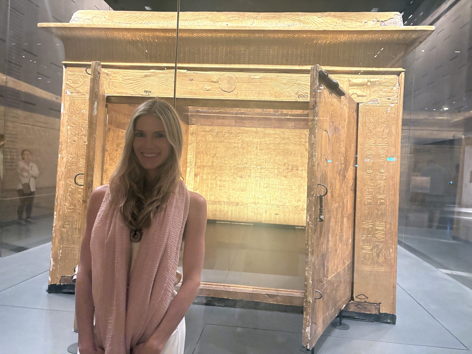 Rachel standing in front of a large gilded wooden shrine
