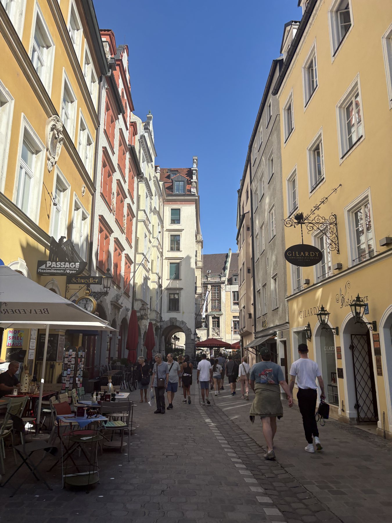 A pedestrian street of pastel buildings in Munich's old town
