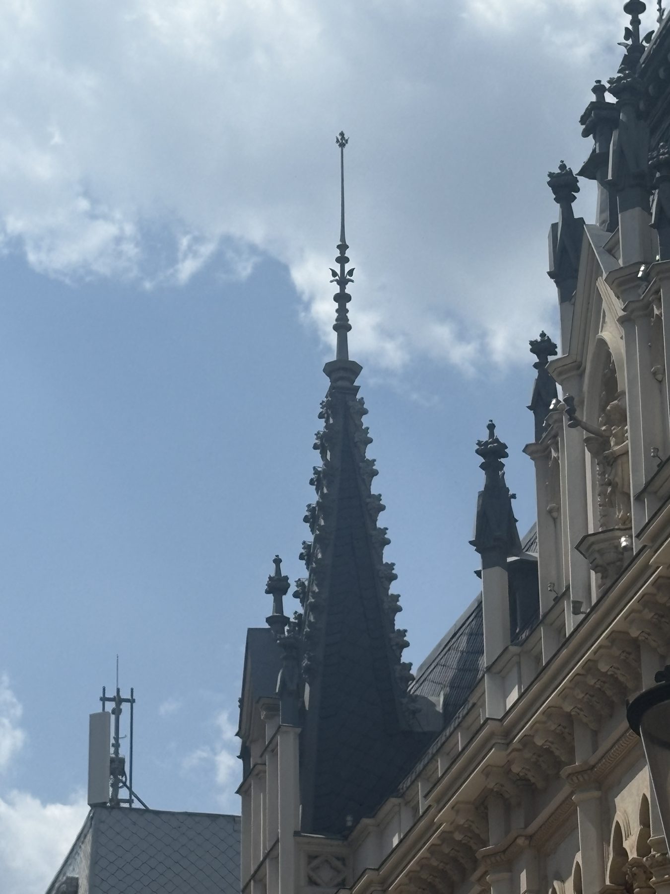 A church spire against clouds in Bucharest