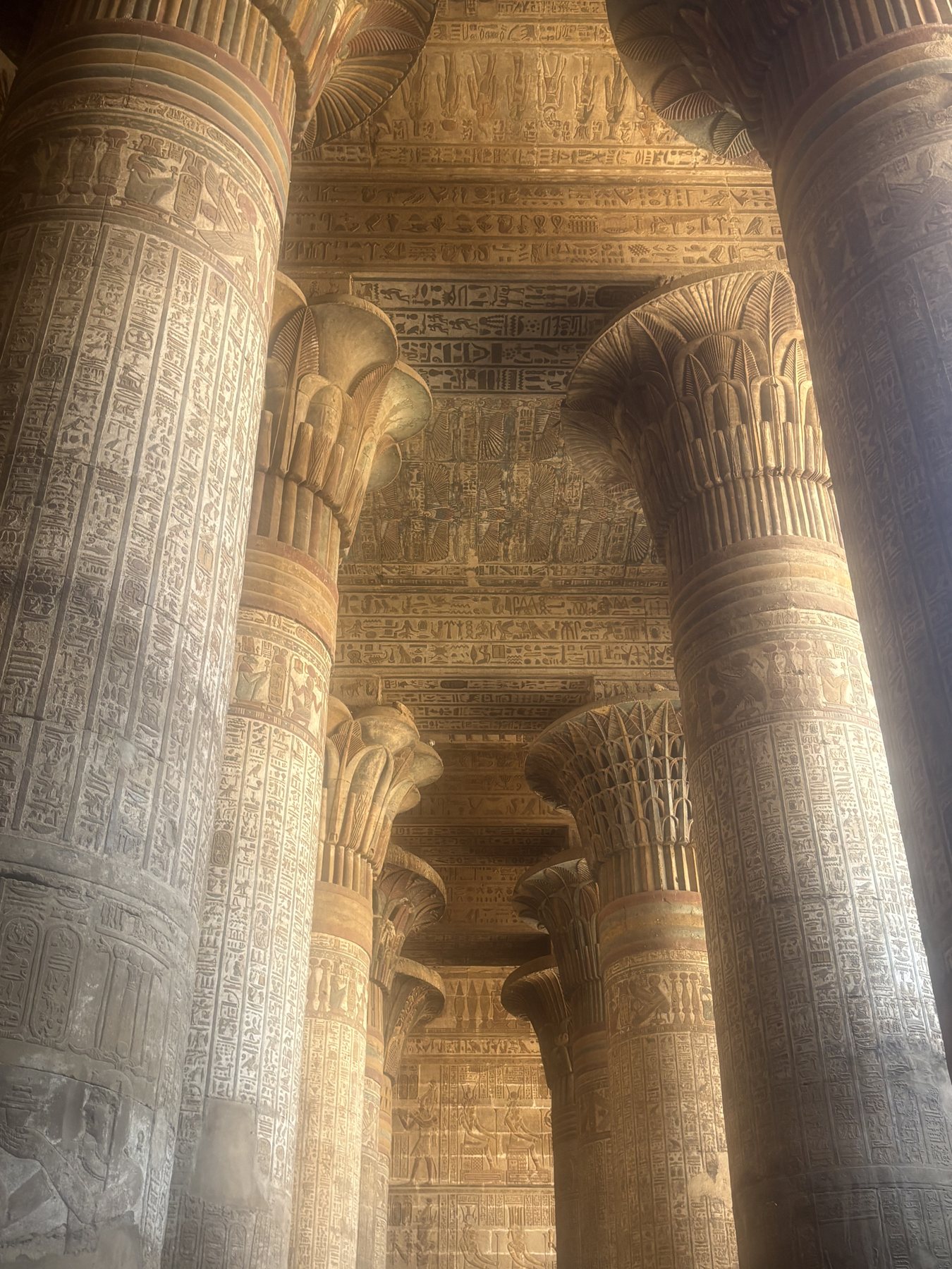 The hypostyle hall of Dendera Temple with painted ceiling