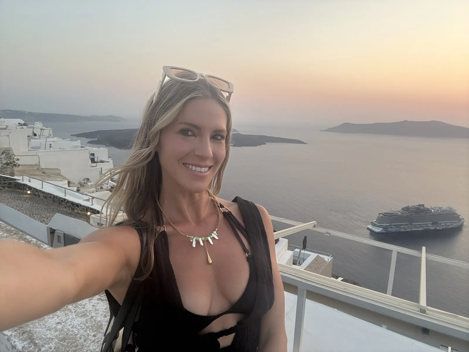 Rachel at golden hour above the Santorini caldera